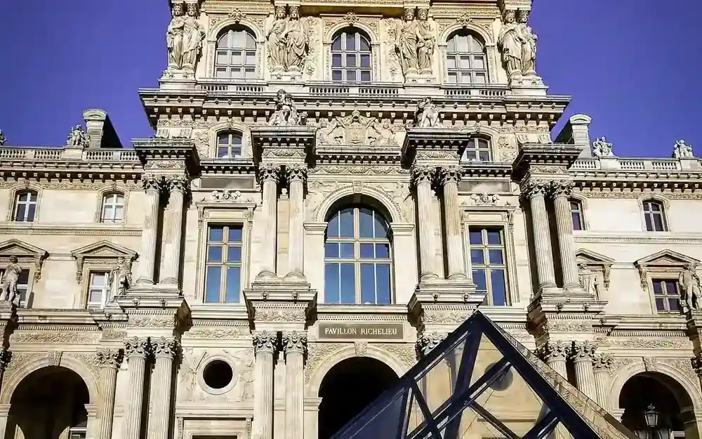 Louvre district and evening Paris architecture